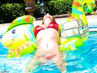 Amateur mom Nikki Sims playing with her covered up boobs in swimming pool