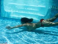 Amateur mom Nikki Sims playing with her covered up boobs in swimming pool