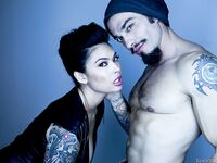 Tattooed sexy pornstar Asian showing big tits in sheer lingerie
