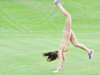 Fit chick strips off sports workout clothes to model naked on golf course