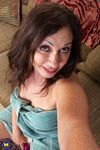 Brunette cougar Samy Rodriguez massages & toys her meaty pussy to orgasm