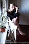 Erotic young Daniel Sea strips at her desk to spread her long legs wide open