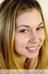 Teen first timer with a pretty face licks a nipples as she disrobes on bed