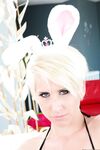 Short haired blonde babe Dylan Phoenix posing with her black strap-on