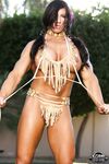 Muscled female Angela Salvagno exposes her big clit in Native American garb