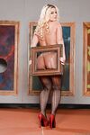 Big boobed blonde Julie Cash posing solo in pantyhose and high heels