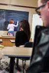 Redheaded teacher Penny Pax has sex with a male student during class