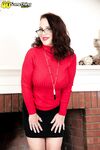 Middle aged lady Cora Comfort uncups her great tits as she disrobes
