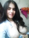 Indian girl takes self shots with big natural tits free of blouse