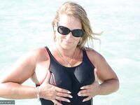 Blonde amateur SweetSusi pulls her tits out form her swimsuit in the pool
