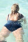 Blonde amateur SweetSusi pulls her tits out form her swimsuit in the pool