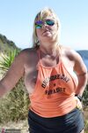 Slutty mature nudist with large tits Chrissy shows her hot curves at the beach