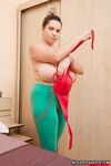 Plump girl Cute Kitty uncups her giant tits before removing yoga pants