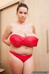 Plump girl Cute Kitty uncups her giant tits before removing yoga pants