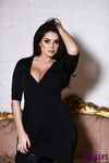 Euro model Charlotte Springer goes topless in black thong and stockings