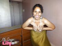 Indian woman lets a boob slip loose from her bra while being a tease