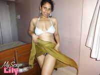 Indian woman lets a boob slip loose from her bra while being a tease