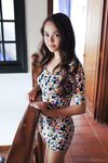 Brunette teen Li Moon hikes up her dress to expose tight vagina
