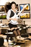 Asian playmate Grace Kim showing her spectacular melons in the music room
