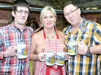 Thick blonde serves beer with big boobs out after putting in wood in the nude