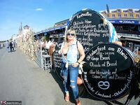 Thick blonde serves beer with big boobs out after putting in wood in the nude