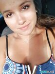 Young looking Latina girl Olivia hides her huge tits while taking selfies