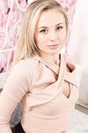 Gorgeous blonde Cassie B goes topless and poses in sheer nylons