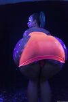 Glowing brunette Jada Stevens flaunts her sexy bubble butt under black light