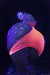 Glowing brunette Jada Stevens flaunts her sexy bubble butt under black light