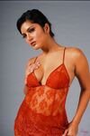Sexy Indian pornstar Sunny Leone sheds sheer lingerie baring pierced nipples