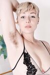 Attractive blonde Dakota Rose flaunts big ass & spreads her big hairy pussy