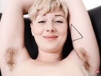 Attractive blonde Dakota Rose flaunts big ass & spreads her big hairy pussy