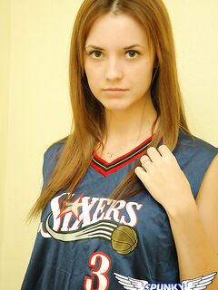 Young cheerleader Amy lifts her uniform to tease with sexy panties & underboob