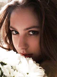 Sultry teen Valery Leche gets into a petal filled tub after removing lingerie