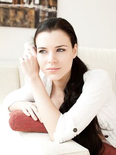 Pretty brunette with gorgeous face Valeria A lounging on sofa in the nude