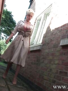 Big tits mature slut Lady Sonia is pissing somewhere behind a house