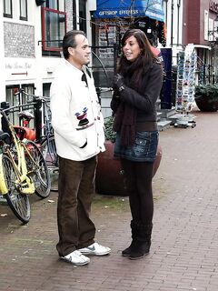 Visiting sex tourist pick up a couple of hookers from the red light district