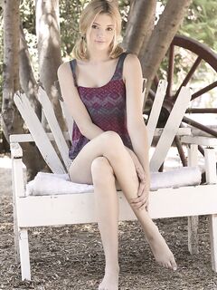 Teen first timer Lena Anderson vaunts her lithe body under a tree outside