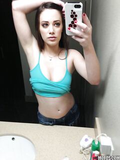 Hot amateur pictures herself as she strips down and teases her pussy
