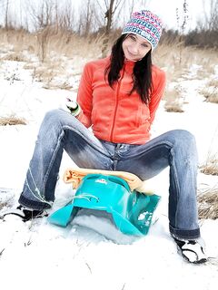 Barely legal girl shows her tits and ass in middle of a field during winter