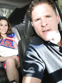 Frisky teenage cheerleader revealing her goods on the back seat
