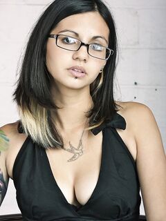 Glasses clad Holly D with big tits drops dress & sheer panties to pose naked