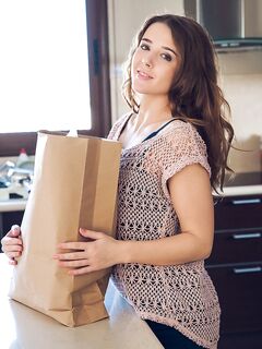Petite brunette Sybil A poses her naked teen body on kitchen counter in socks