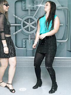 Fully clothed girl dance and get soaking wet during sprinkler malfunction