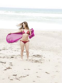 Amazing wet babe Remi showing that beautiful body on the beach