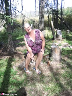 Fat granny Girdle Goddess loses her purple outfit in the woods and poses nude
