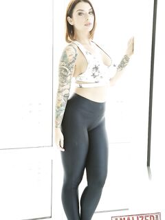 Tattooed hottie Ivy Lebelle shows her curvy body and stretches her butt