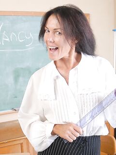Naughty granny Nancy gets completely naked in the school room