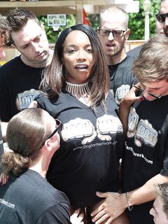 Busty black girl Daya Knight gets on her knees in the backyard for a blowbang