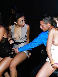 Young pornstars engaging in reverse gangbang and lesbo sex in nightclub